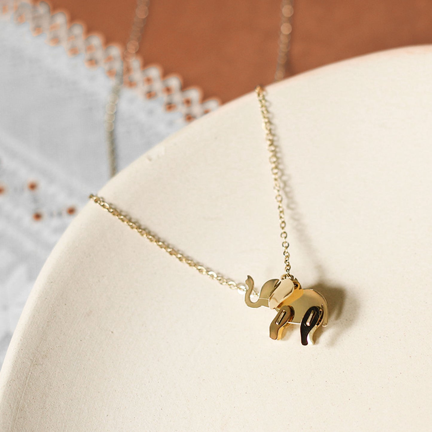 Elephant necklace in a white plate