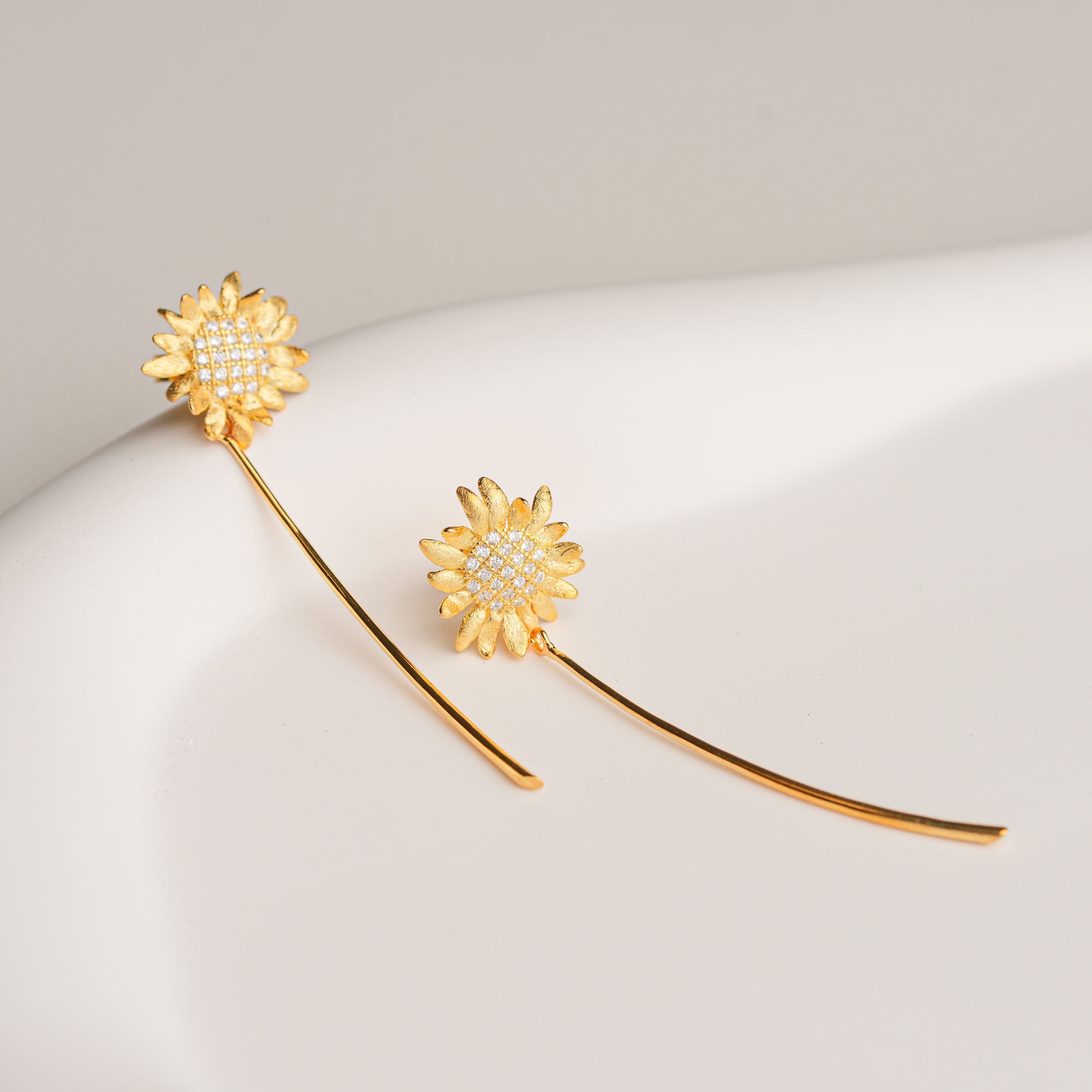 Gold sunflower earrings with tassel dangles