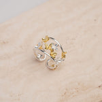 Adjustable sterling silver flower ring with botanical design