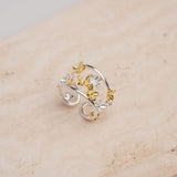 Adjustable sterling silver flower ring with botanical design