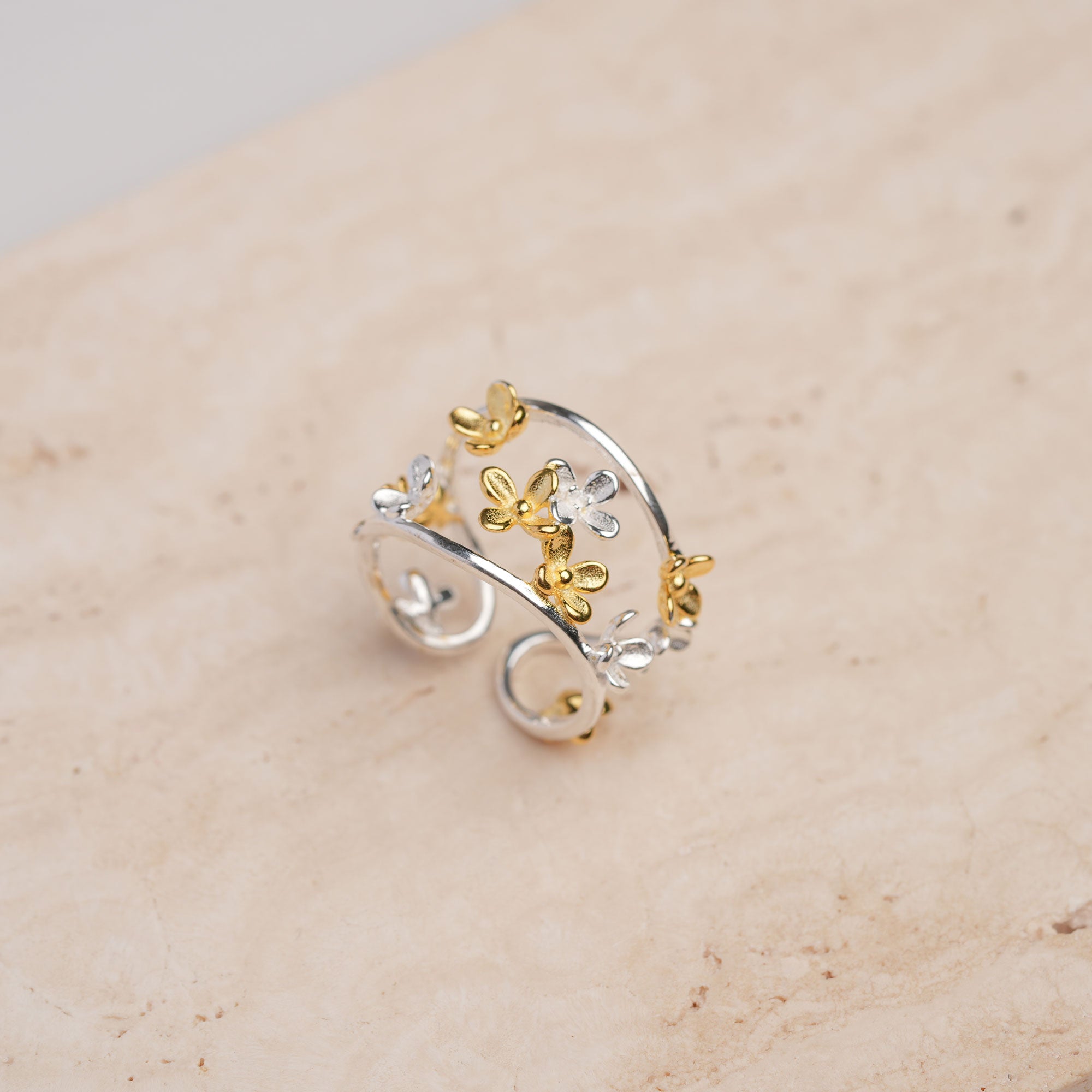 Adjustable sterling silver flower ring with botanical design