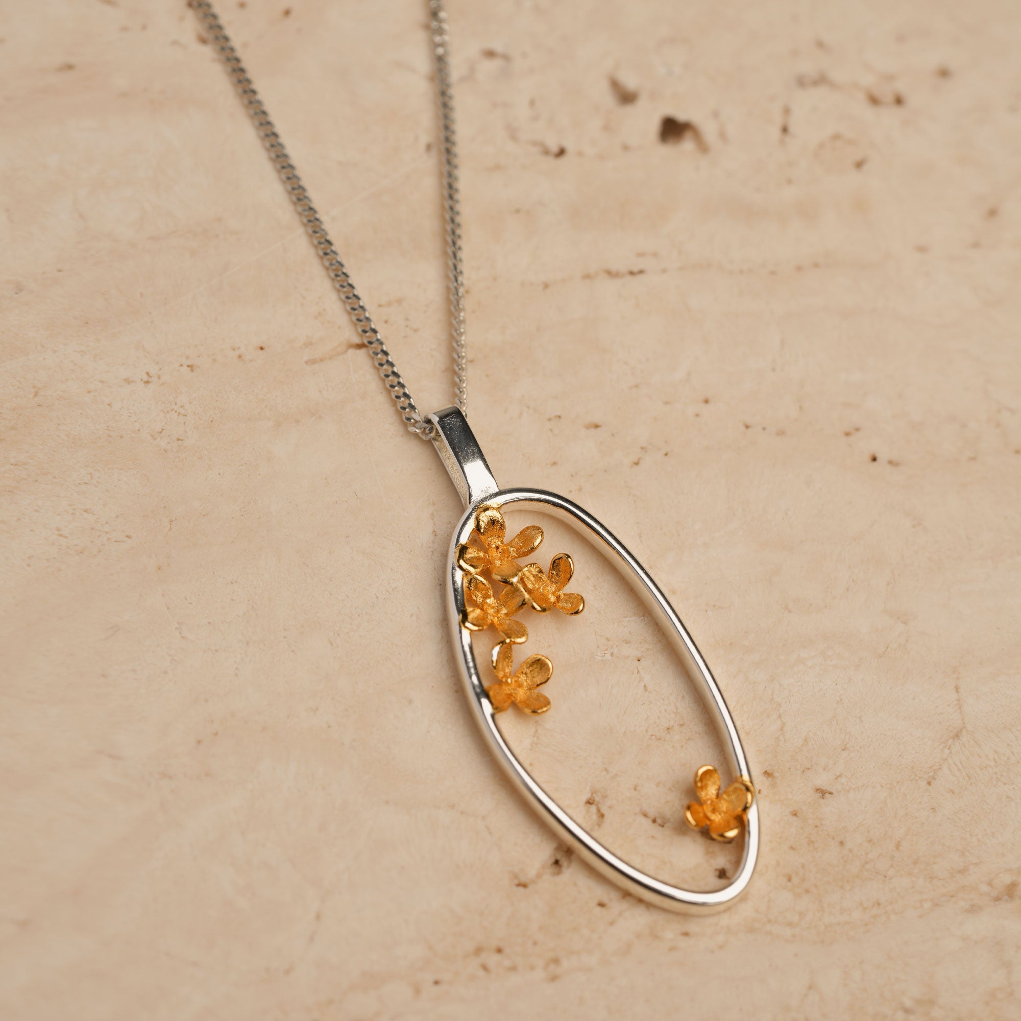 Blooming osmanthus pendant close-up