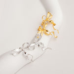 Bow earrings with delicate ribbon shape