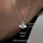 Butterfly orchid necklace displayed on neutral background