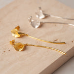 Calla lily drop earrings displayed as a pair