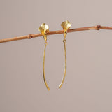Gold calla lily earrings close-up