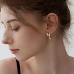 Carrot earrings showing handmade vegetable charm details