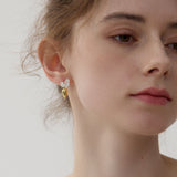 Carrot earrings displayed as a pair