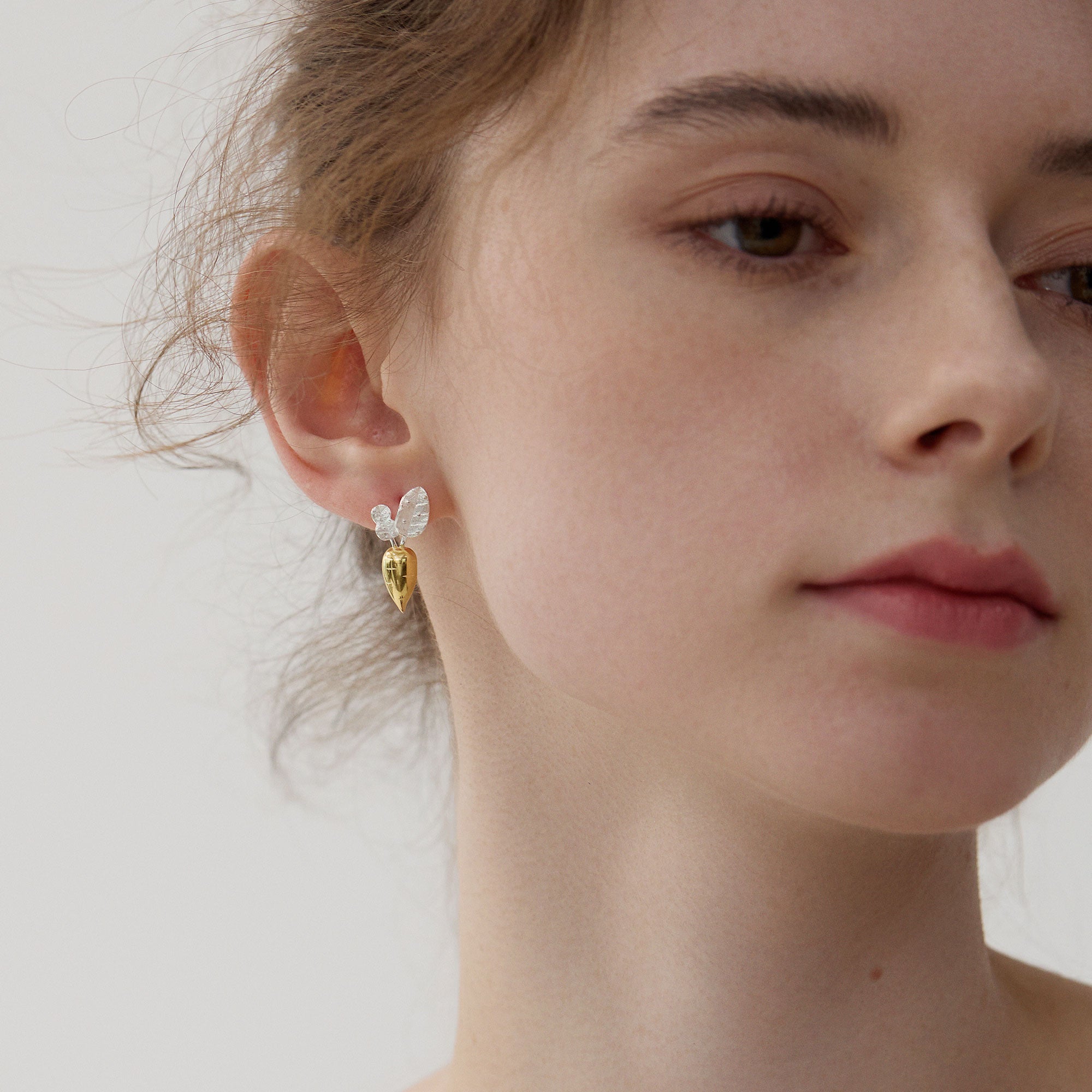 Carrot earrings displayed as a pair