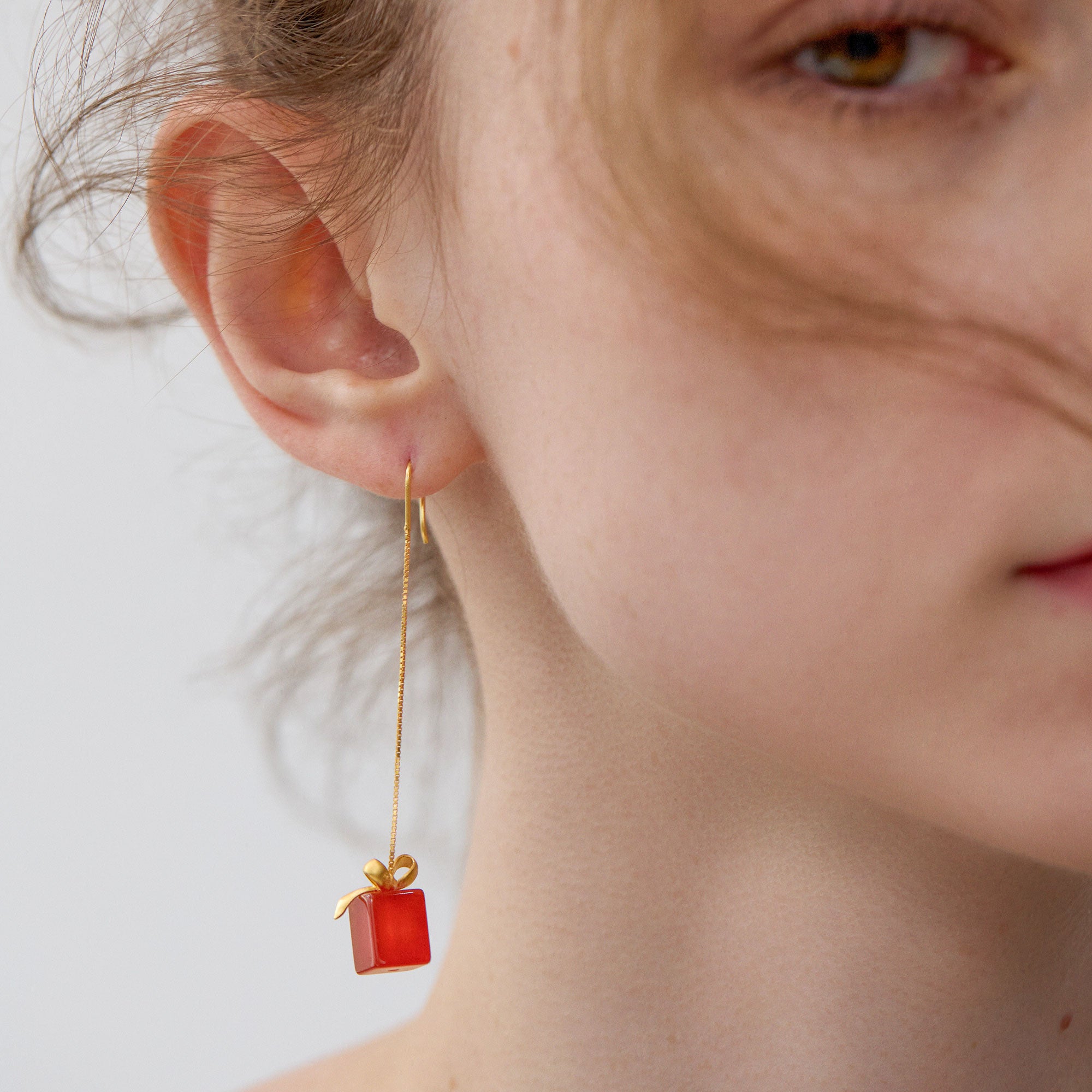 Christmas present earrings with festive gift box design