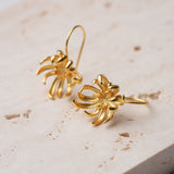 Chrysanthemum design earrings with floral details