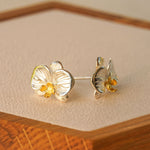 Close-up of phalaenopsis orchid earrings