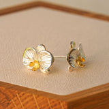 Close-up of phalaenopsis orchid earrings