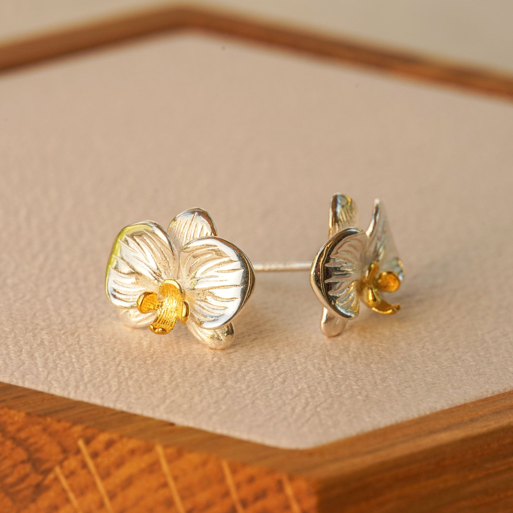 Close-up of phalaenopsis orchid earrings