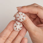 Cornflower bloom studs displayed as a pair