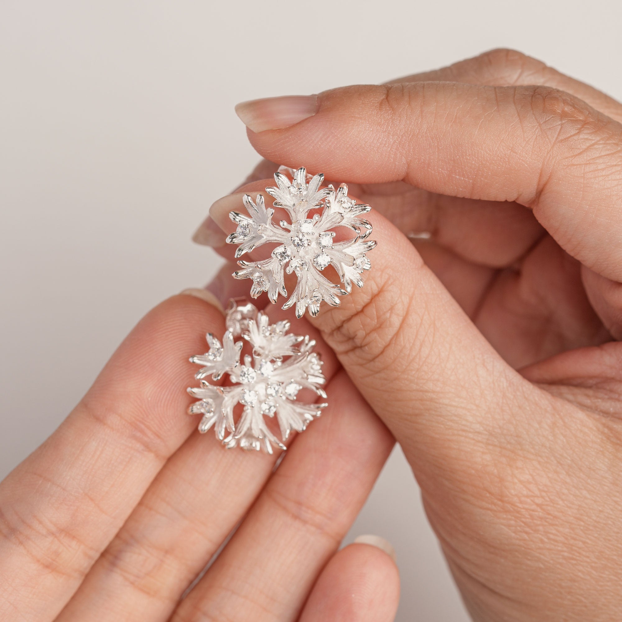 Cornflower bloom studs displayed as a pair