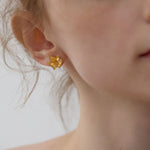 Daffodils earrings displayed as a pair