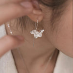 Delicate orchid jewelry earrings close-up