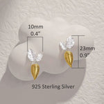 Detailed view of carrot earrings