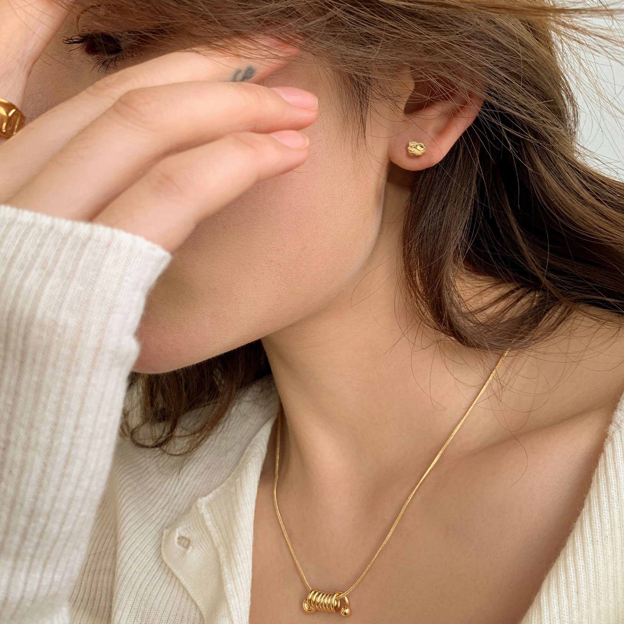 Detailed view of stone earrings