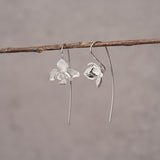Elegant orchid drop earrings with floral petal design