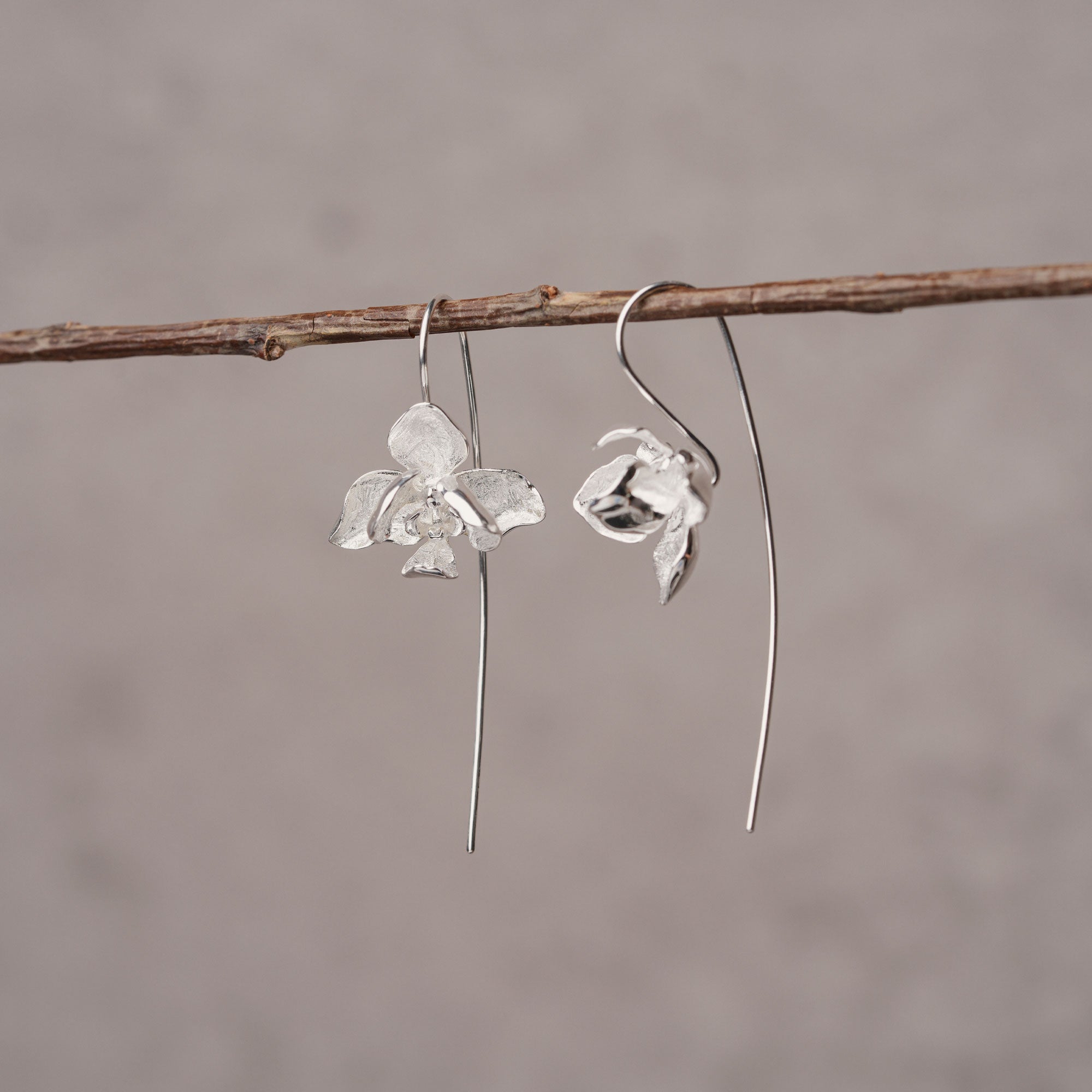 Elegant orchid drop earrings with floral petal design
