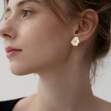 Floral poppy earrings showing flower design