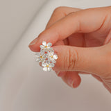 Forget-me-not earrings on neutral product background