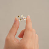 Forget-me-not flower adjustable ring displayed on neutral background