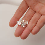 Forget-me-not stud earrings showing handmade details