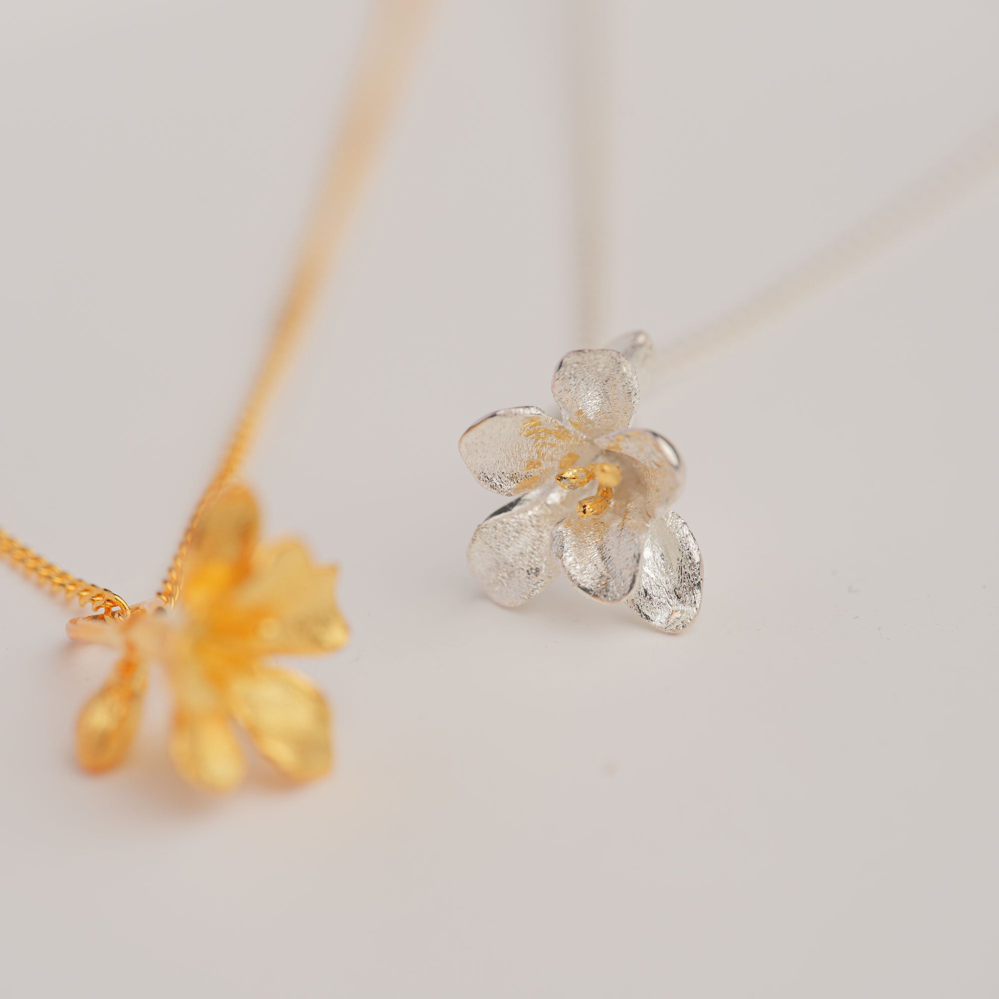 Freesia floral pendant close-up