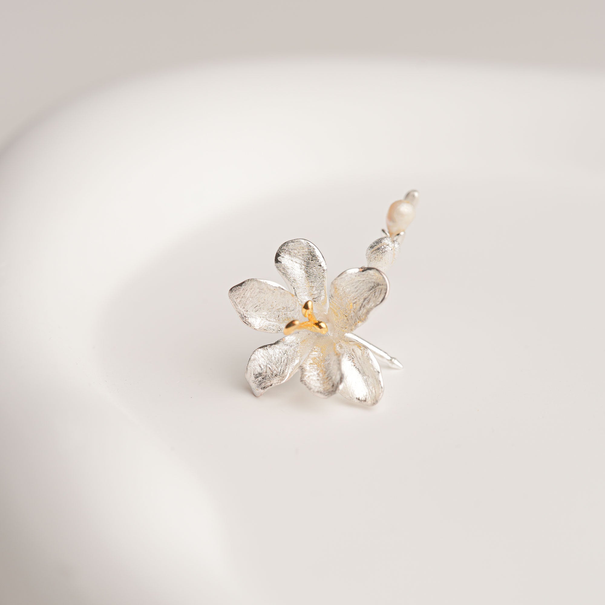 Freesia flower brooch close-up