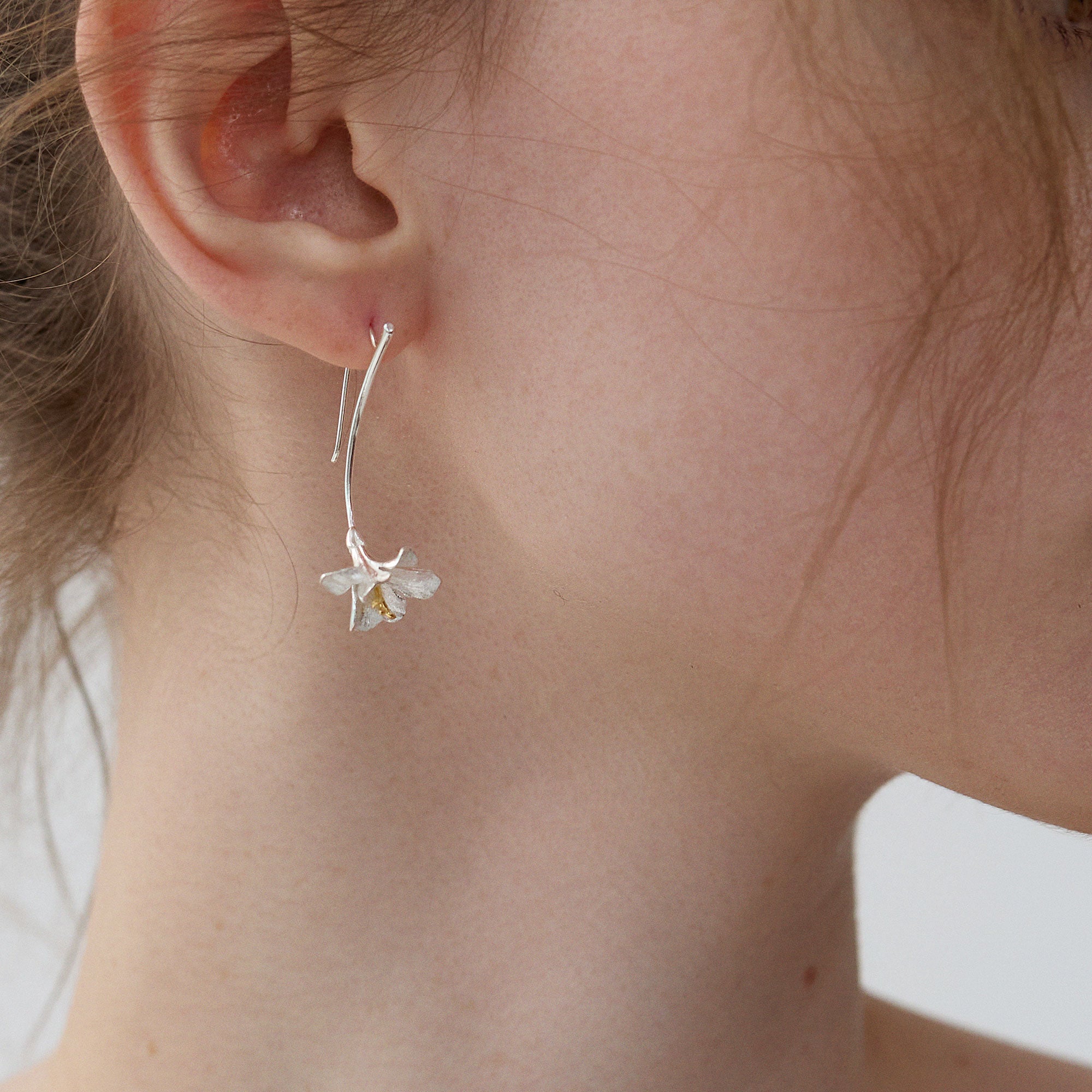Freesia flower earrings displayed as a pair