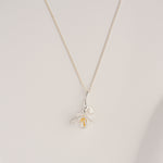 Freesia necklace displayed on neutral background