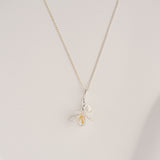 Freesia necklace displayed on neutral background