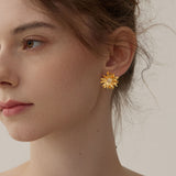 Gerbera daisy earrings displayed as a pair