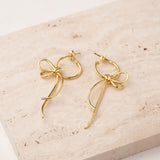 Gold bow knot earrings close-up