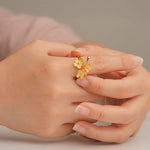 Gold forget-me-not ring close-up