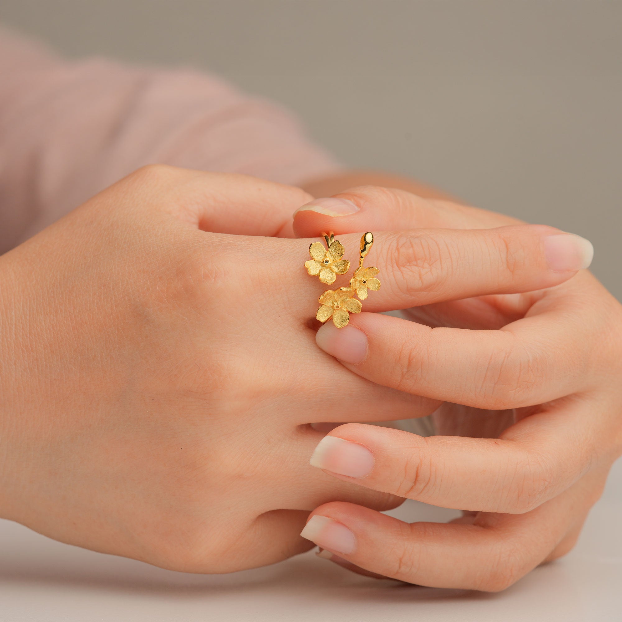 Gold forget-me-not ring close-up