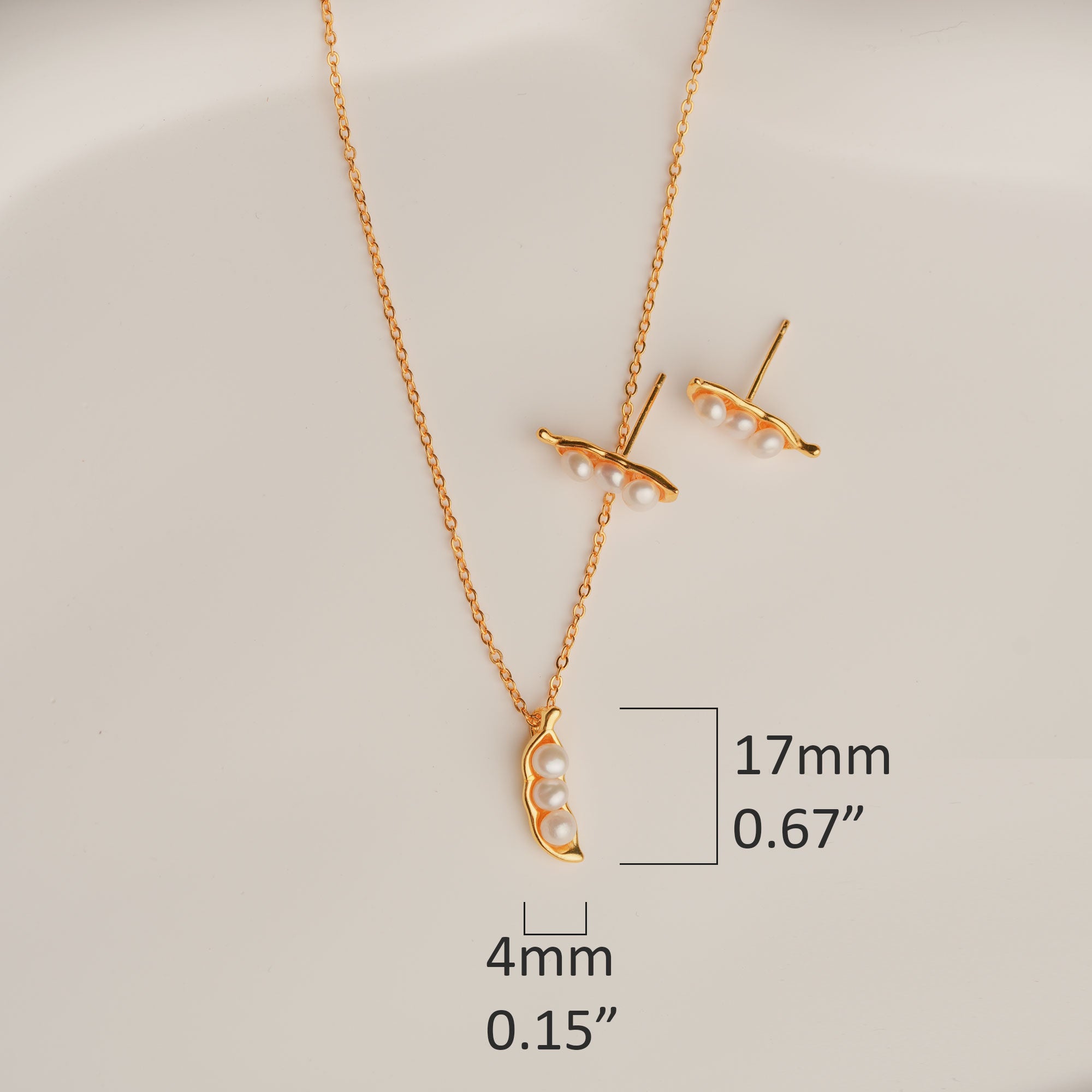 Gold pearl necklace with pea pod friendship design