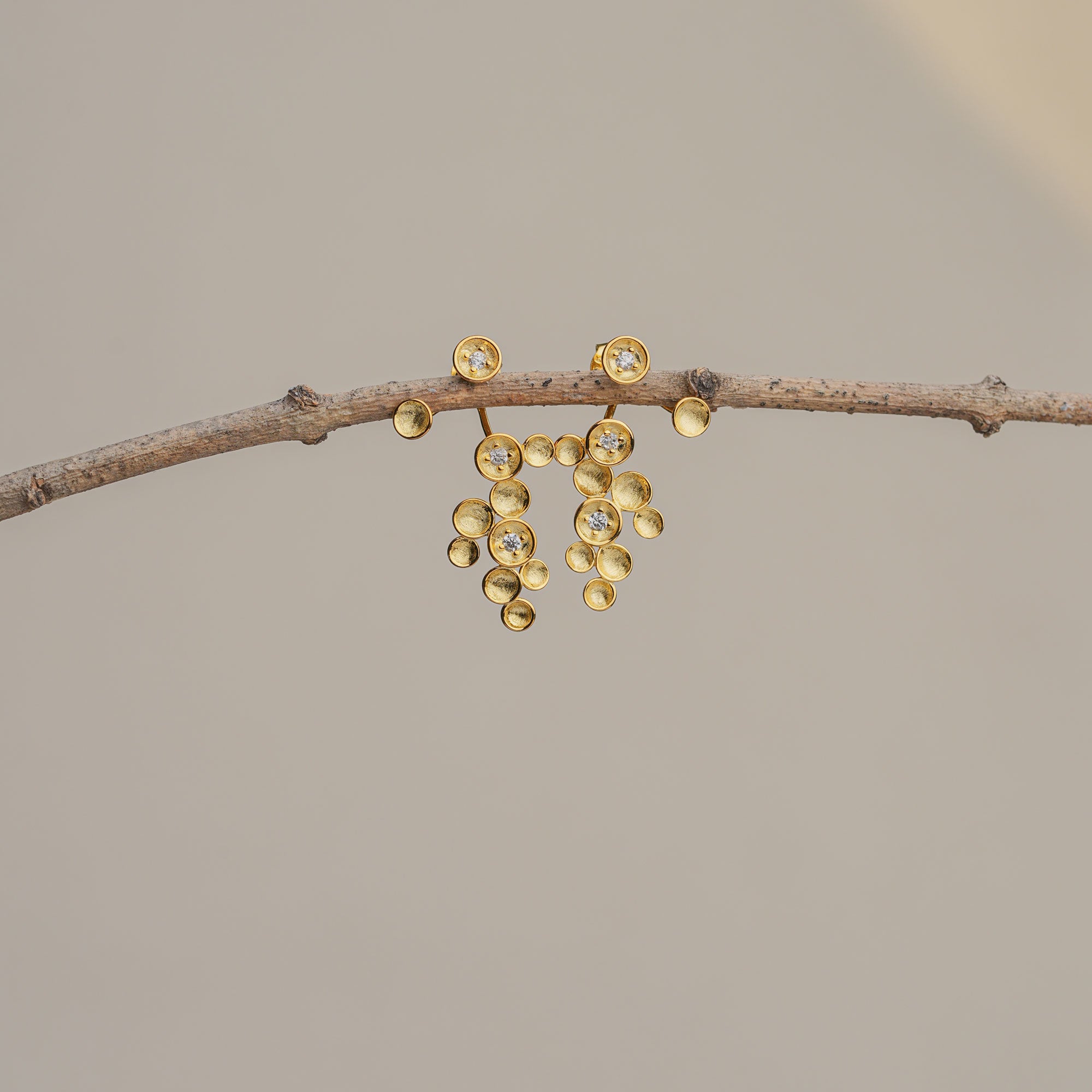 Gold starlight earrings with cascading star details