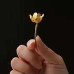 Gold tulip flower pin close-up
