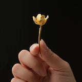 Gold tulip flower pin close-up