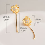 Golden flower earrings shown as sunflower jewelry