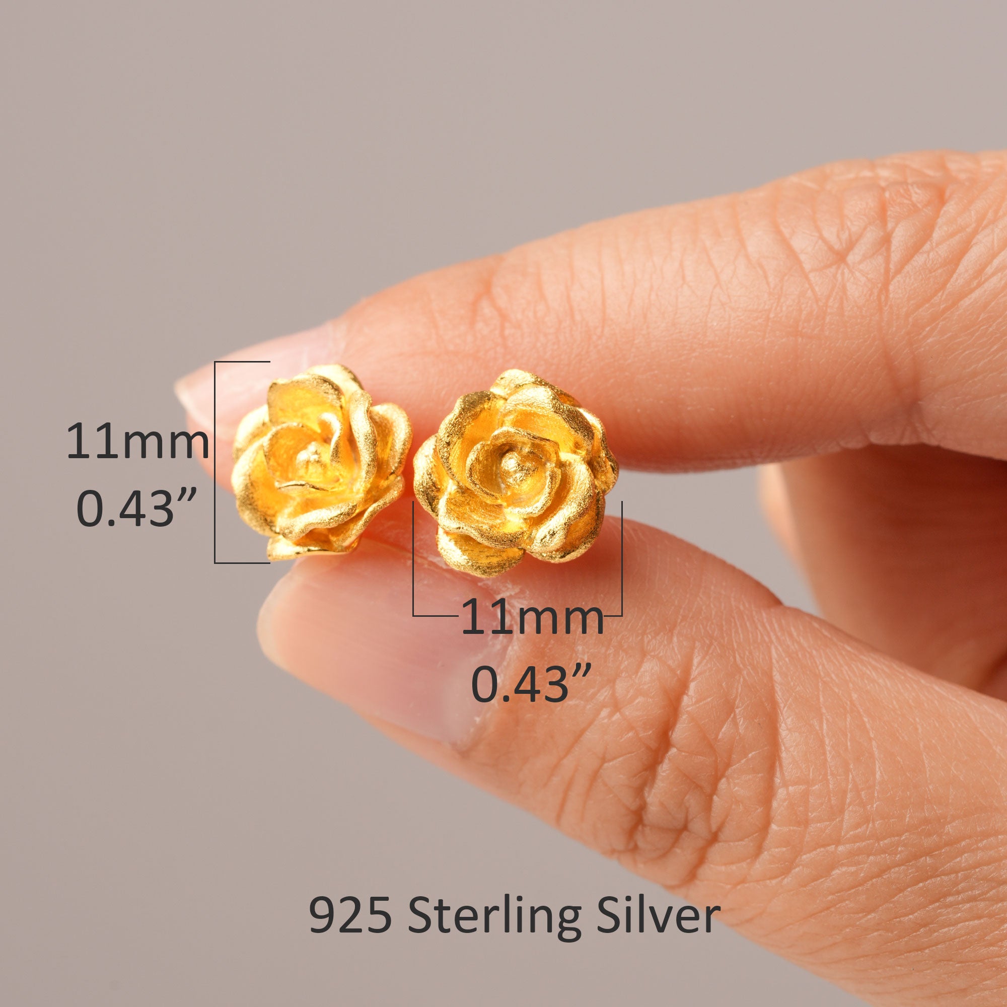 Golden rose earrings close-up
