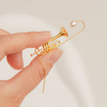 Handmade jazz trumpet brooch in gold-plated finish with freshwater pearl