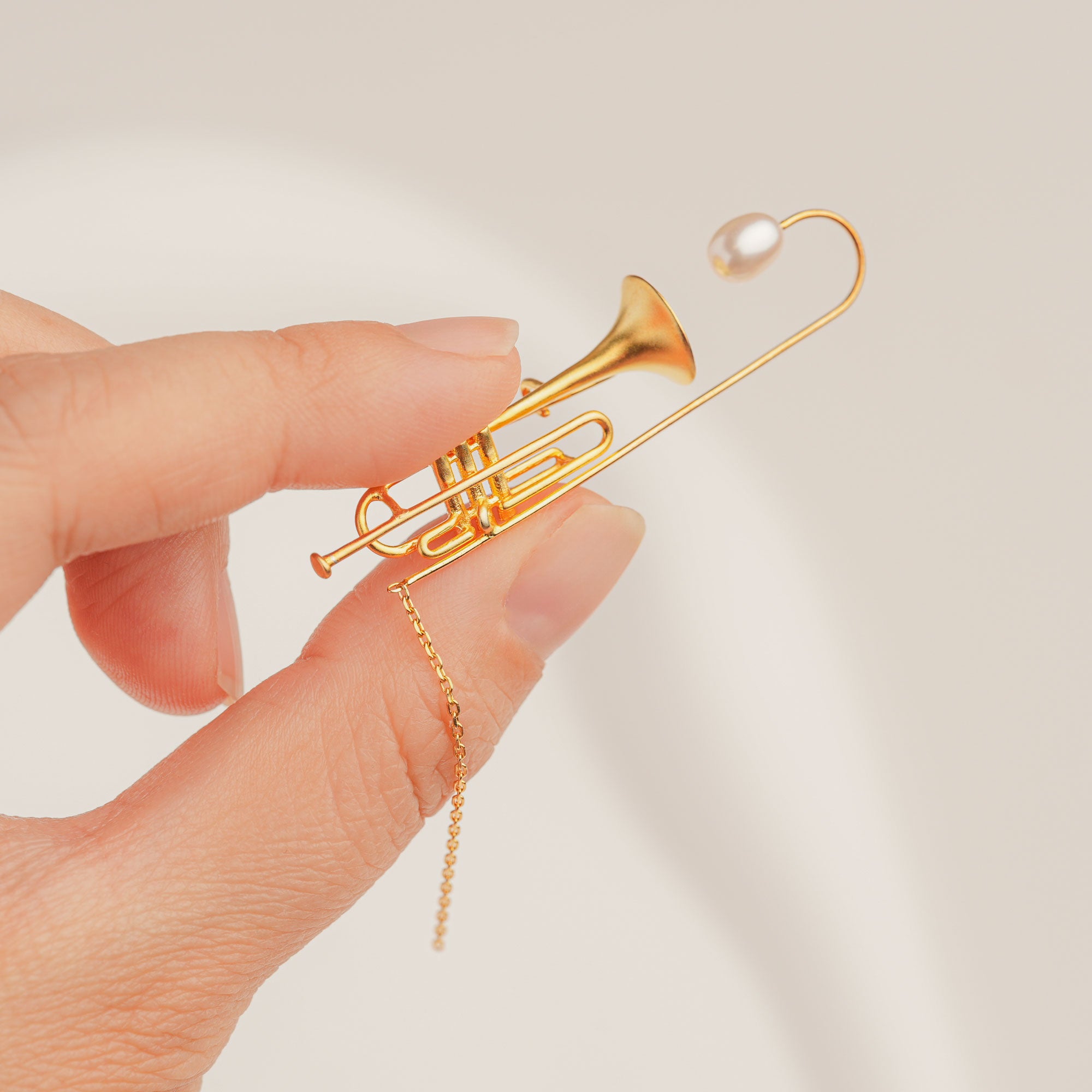 Handmade jazz trumpet brooch in gold-plated finish with freshwater pearl