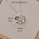 Minimalist flower necklace with orchid pendant