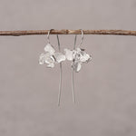 Nature inspired orchid earrings displayed as a pair