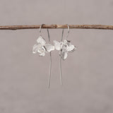 Nature inspired orchid earrings displayed as a pair